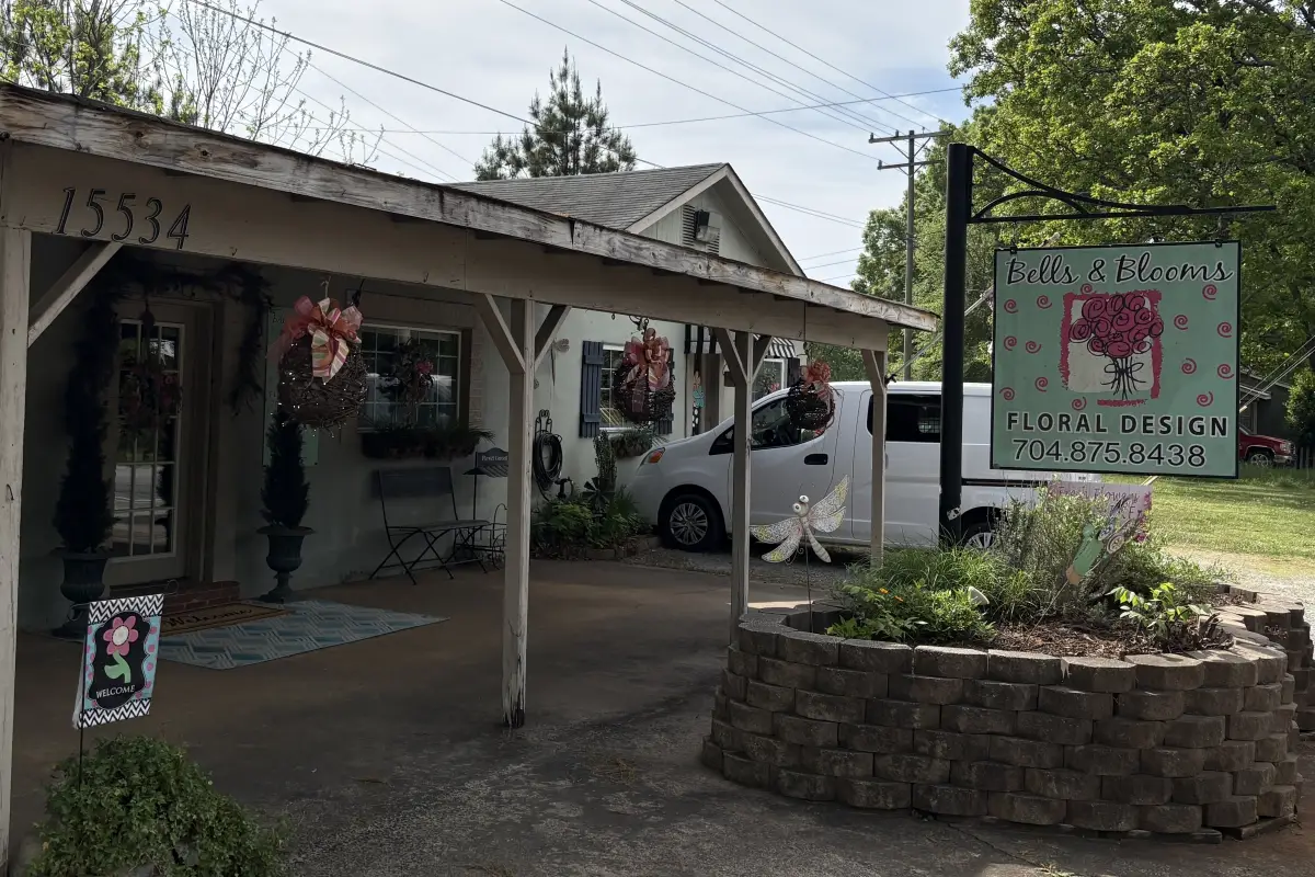 The building and exterior sign of Bells and Blooms 