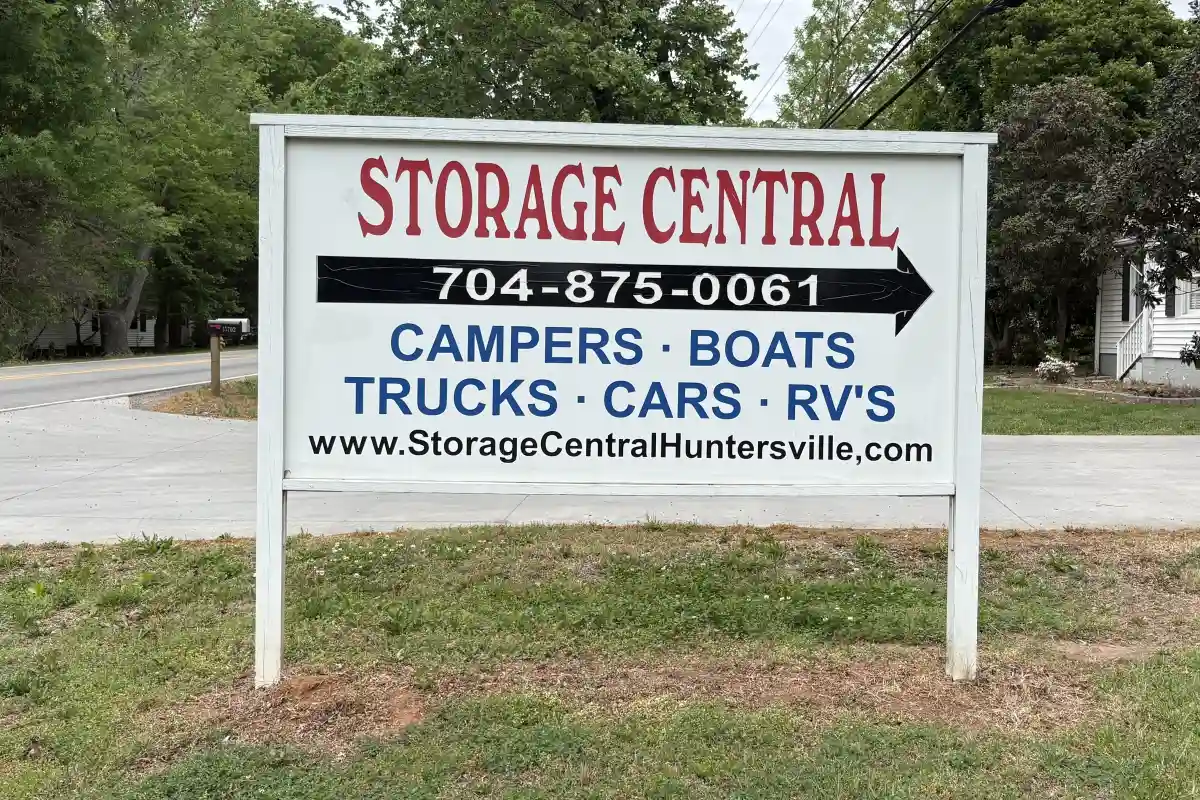 Storage Central sign listing RV, boat, truck, and vehicle storage options with contact information