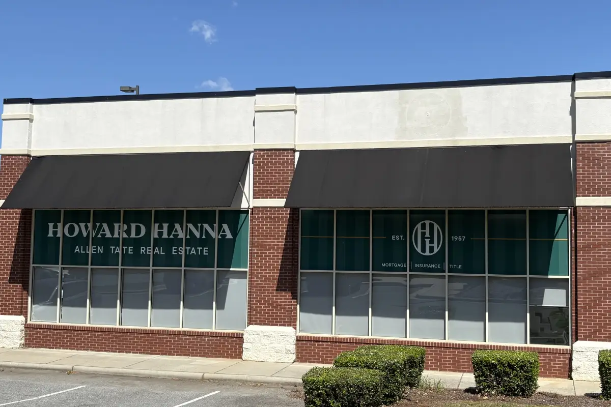 Howard Hanna Tate real estate office exterior with storefront signage