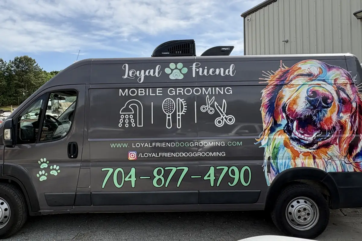 Loyal Friend Dog Grooming mobile grooming van with colorful dog illustration 