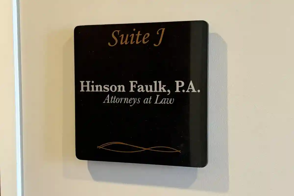 Hinson Faulk law office sign with suite information and attorneys at law branding 