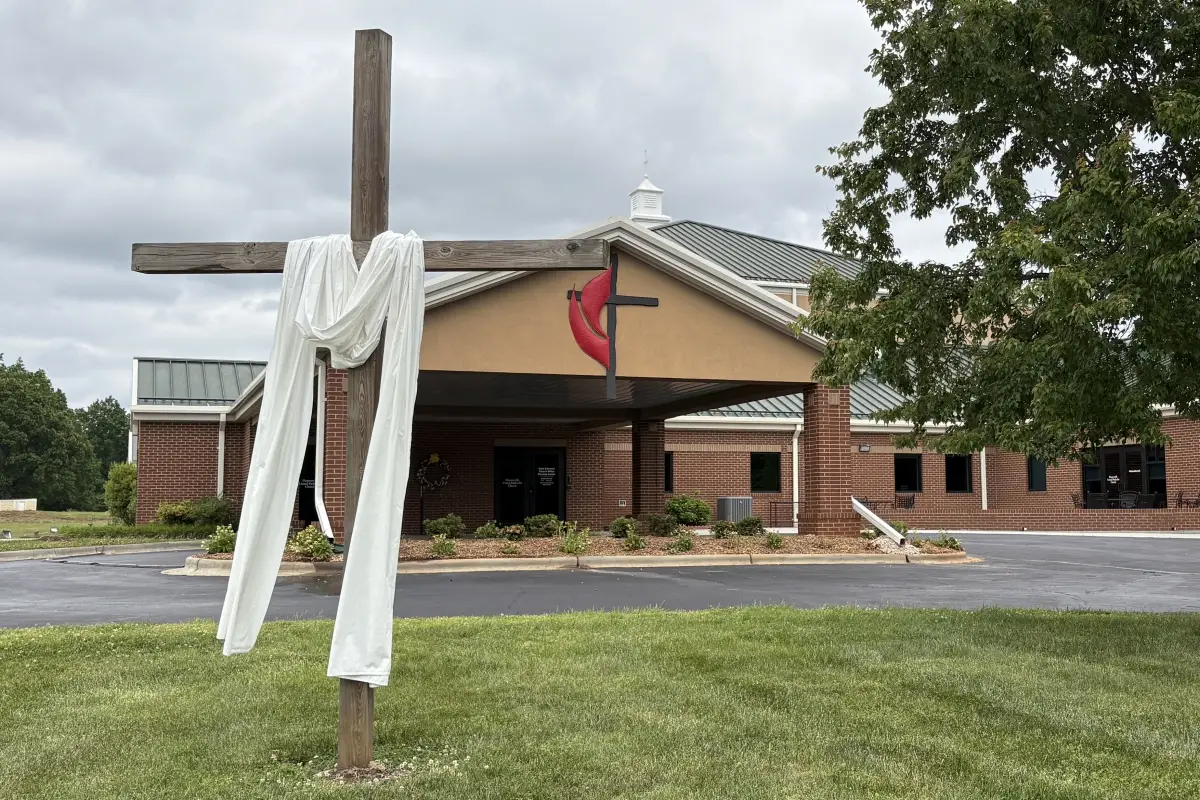 Huntersville United Methodist Church building with cross and entrance