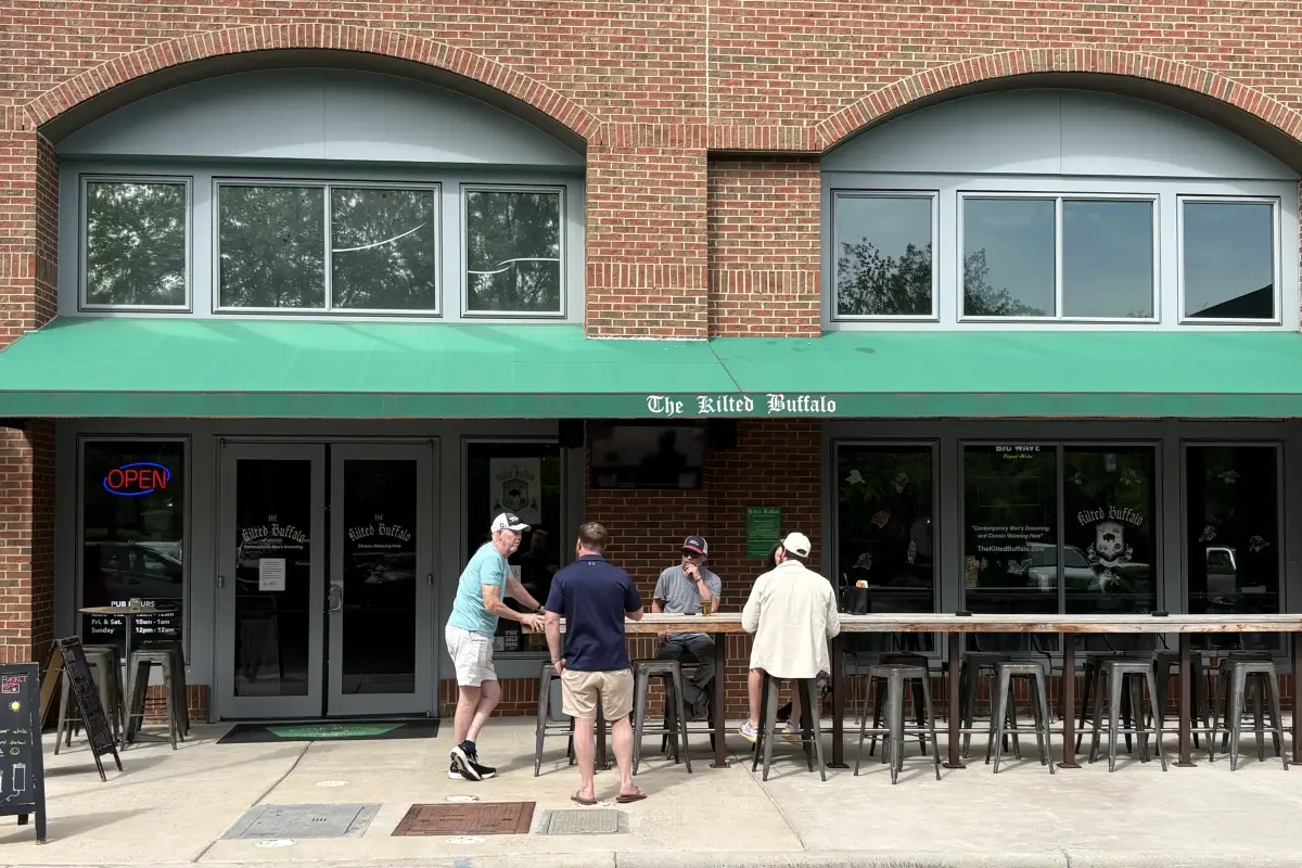 Exterior entrance and outdoor seating at The Kilted Buffalo