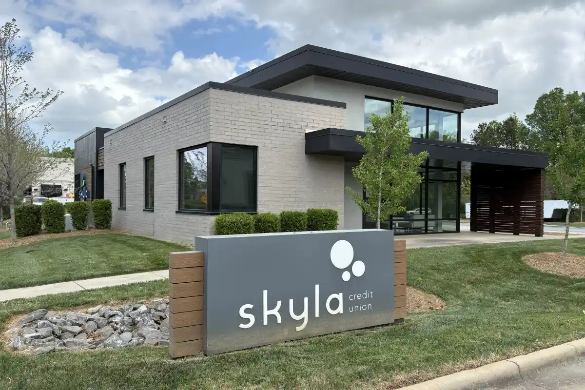 Building exterior of Skyla Credit Union with sign in front