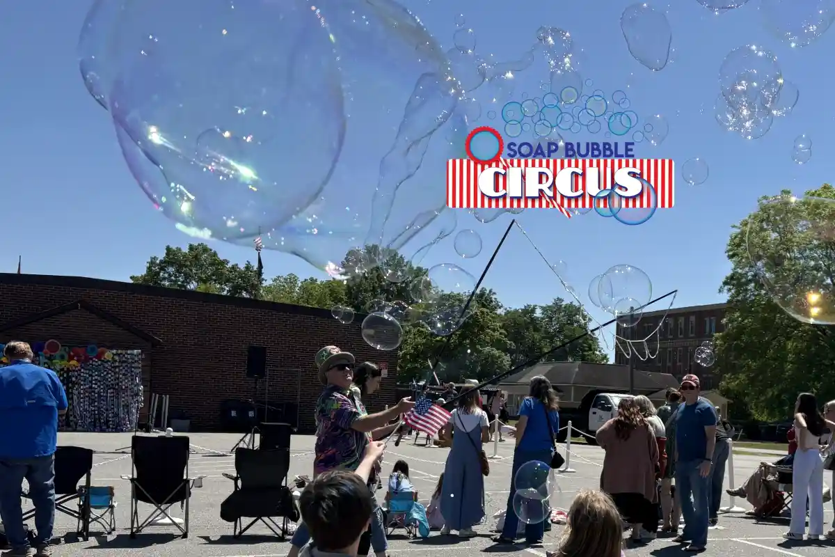 Soap Bubble Circus performer creating giant bubbles during the Hello Huntersville event