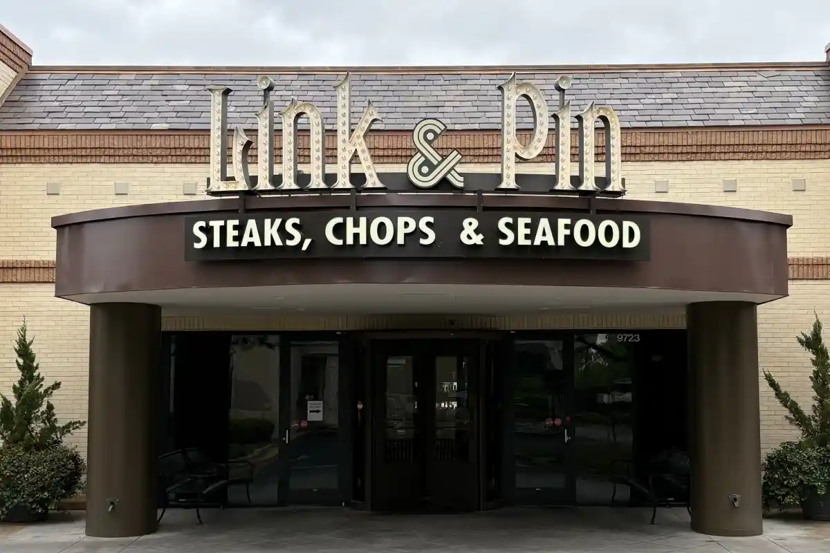 Front entrance and exterior signage for Link & Pin restaurant and cocktail bar