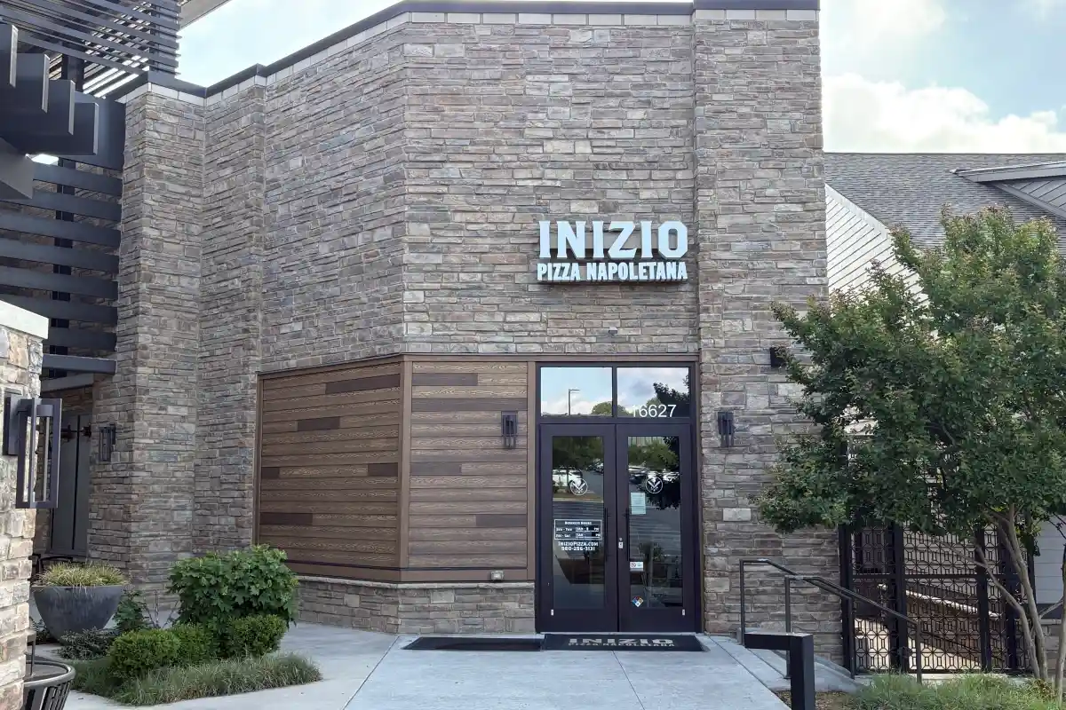 Exterior entrance and signage for Inizio Pizza Napoletana restaurant building