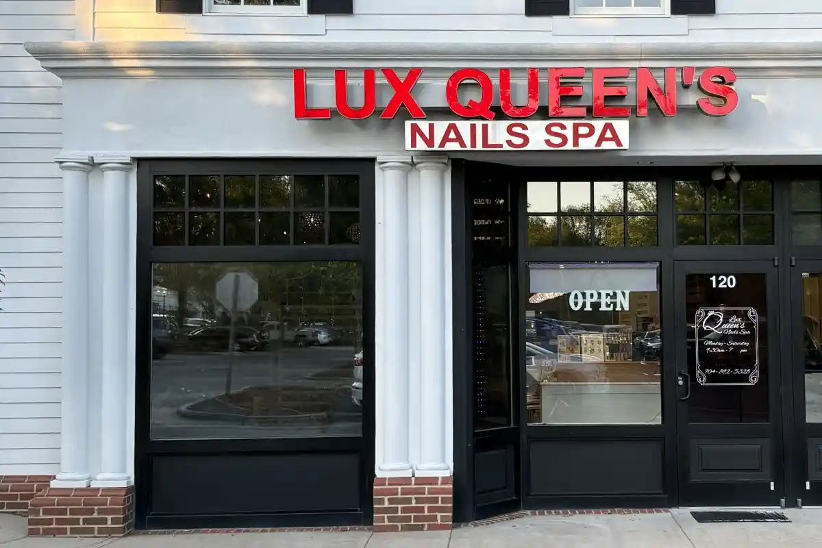 Exterior entrance and storefront signage for Lux Queen's Nails Spa