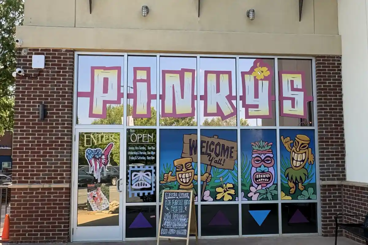 Decorated entrance windows of Pinky’s Westside Grill