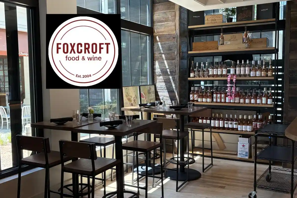 Seating area and wine display case inside Foxcroft Food & Wine