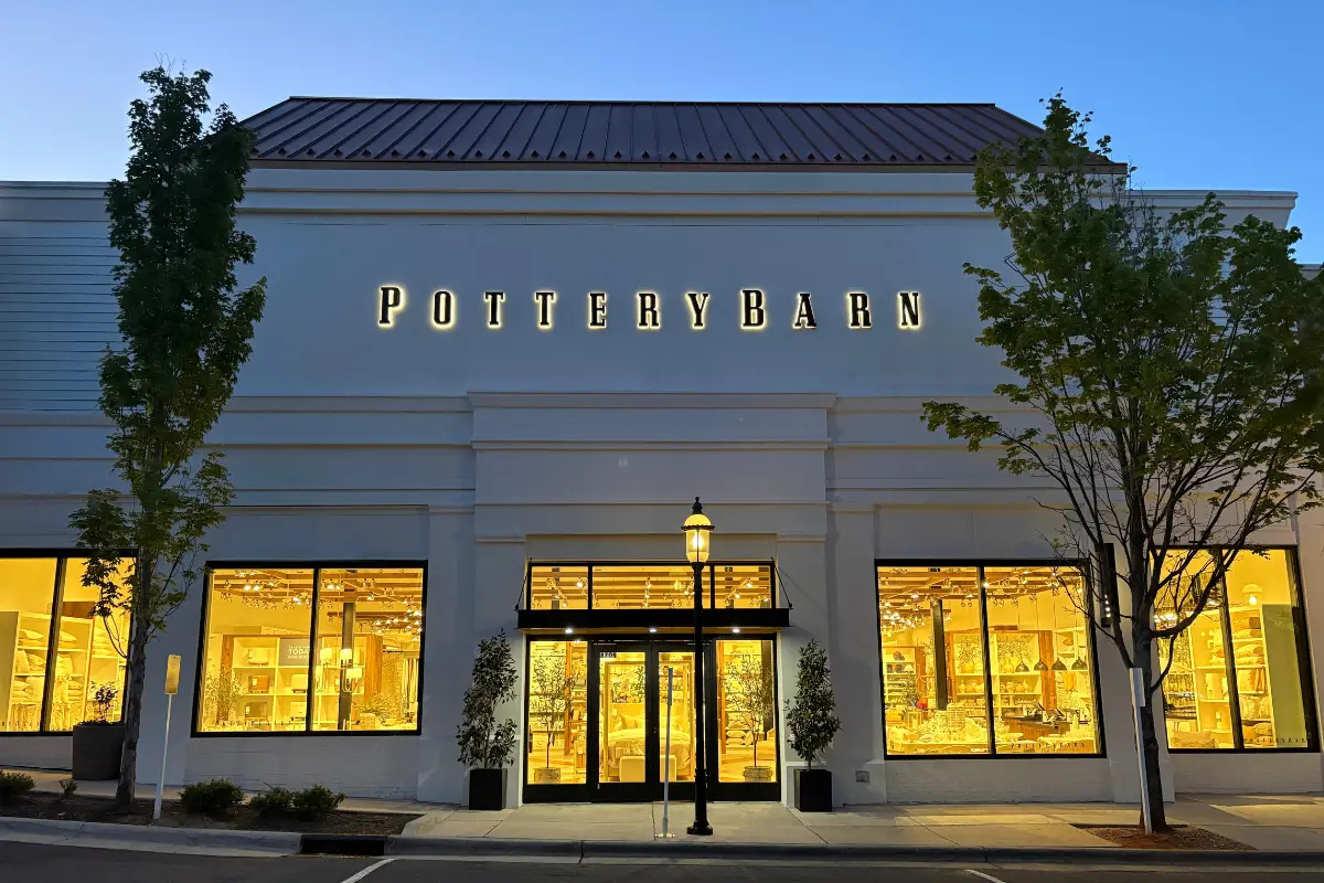 Exterior of Pottery Barn storefront at night