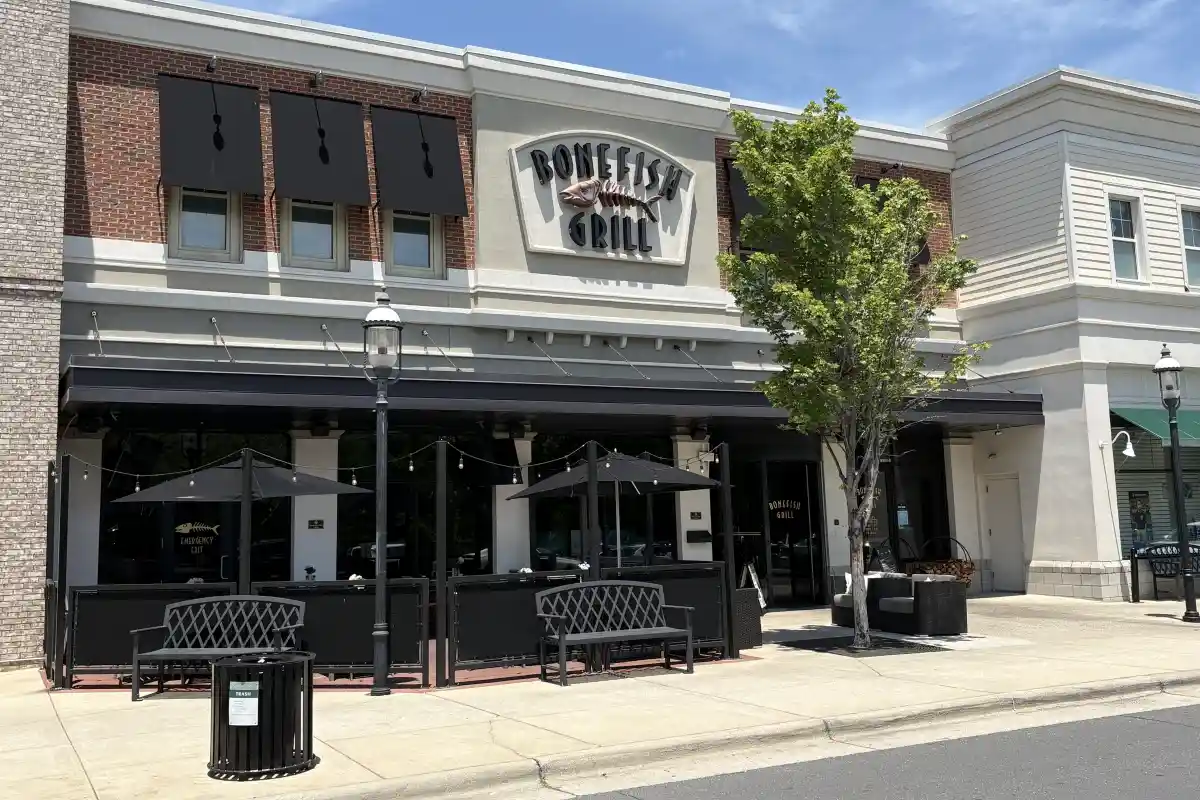 Building exterior, entrance, and outdoor seating area for Bonefish Grill