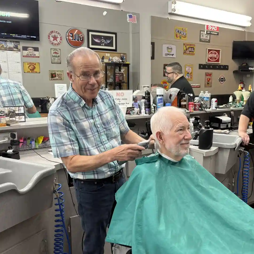 Gary Carter cutting a customer's hair at Scottie's Barber Shop