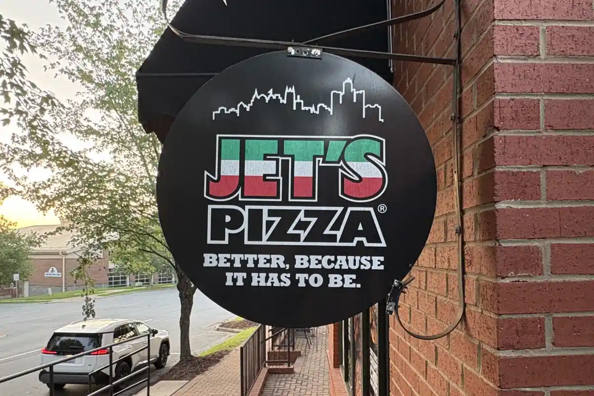 Sign for Jet's Pizza on the outside of their storefront
