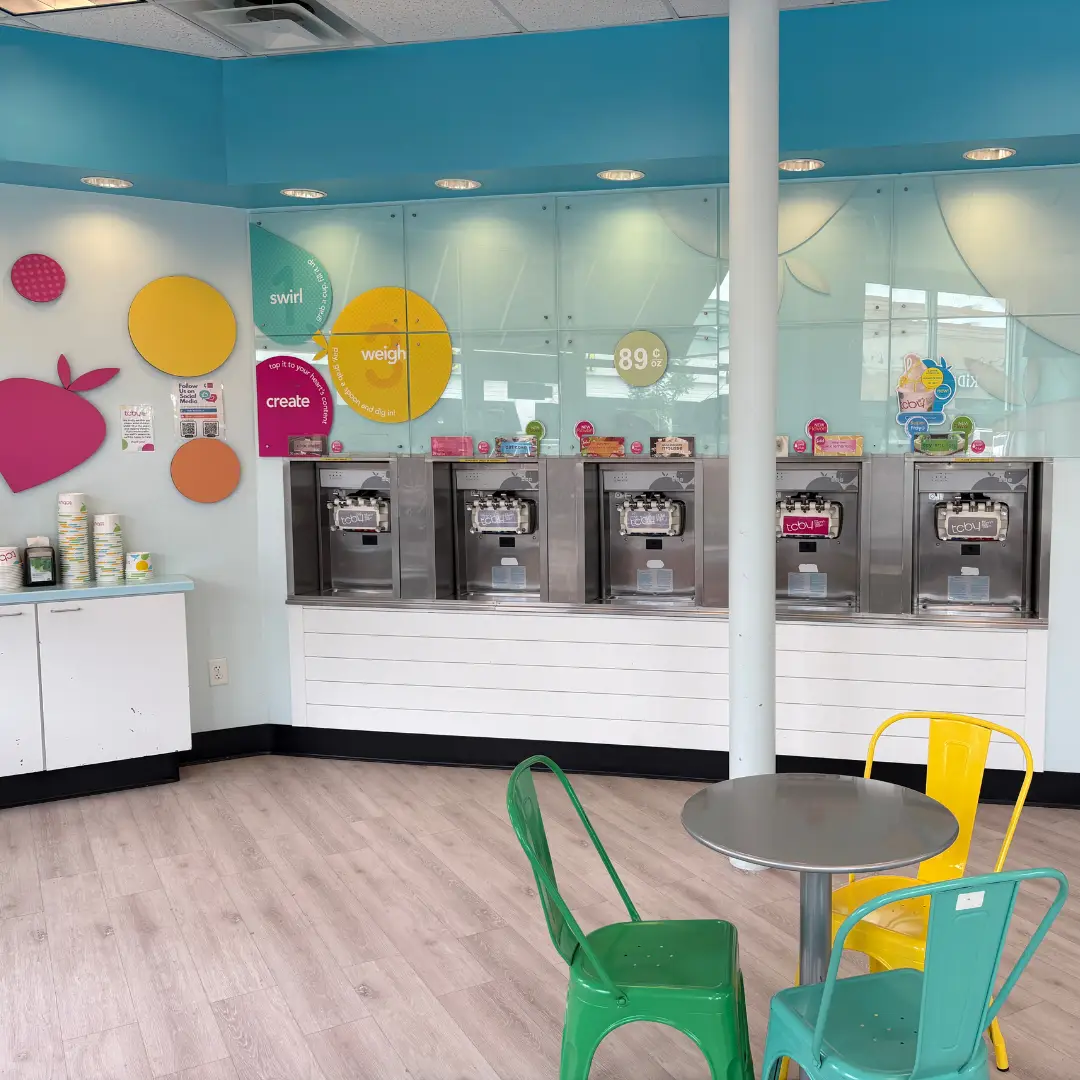 Self-serve frozen yogurt machines inside TCBY Rosedale