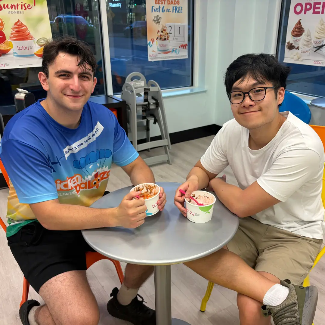 Two customers enjoying frozen yogurt at TCBY Rosedale