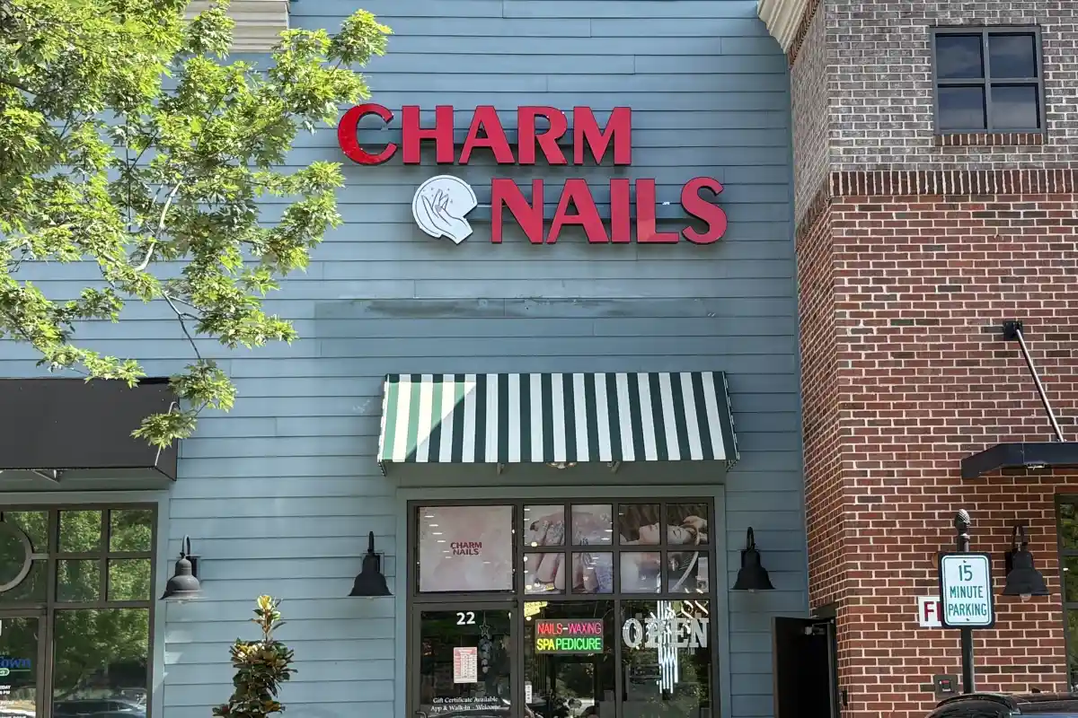 Exterior entrance and sign for Charm Nails