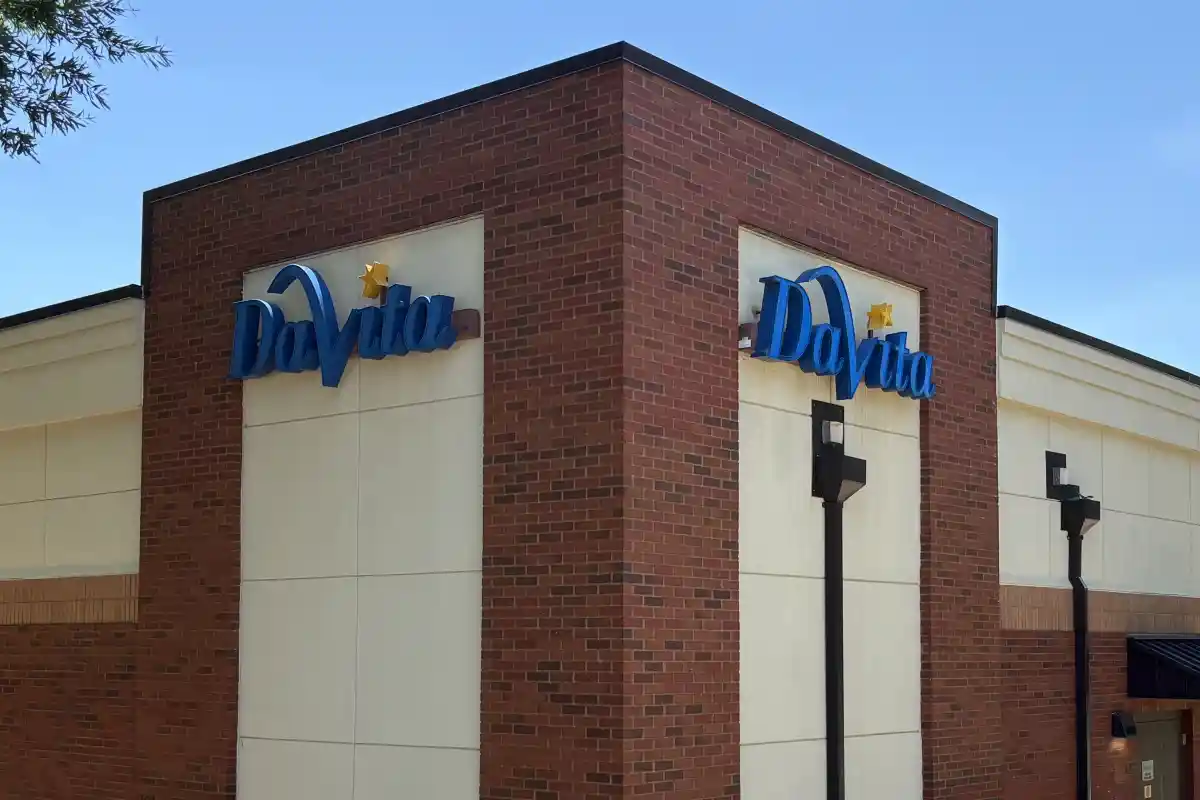 Corner of the DaVita building with two branded signs