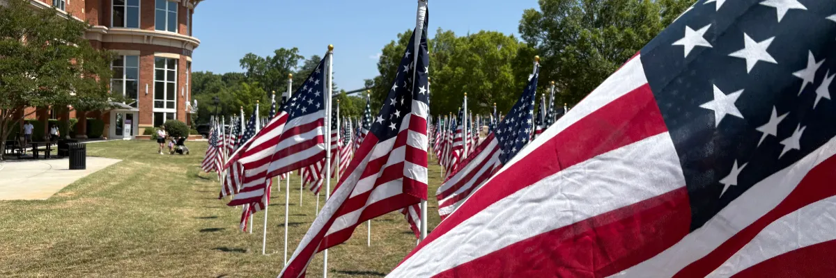 American flags on the lawn outside Discovery Place Kids
