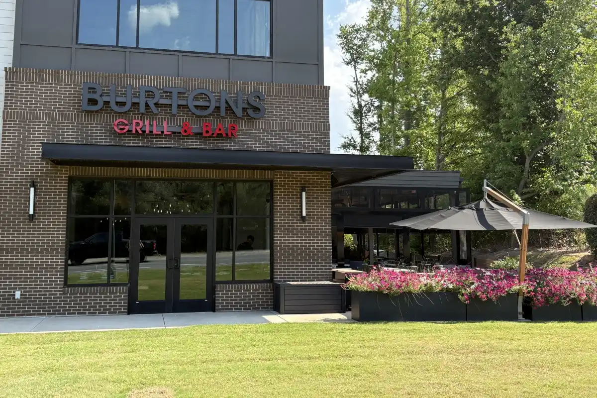 Burtons Grill & Bar exterior and umbrella over outdoor dining area