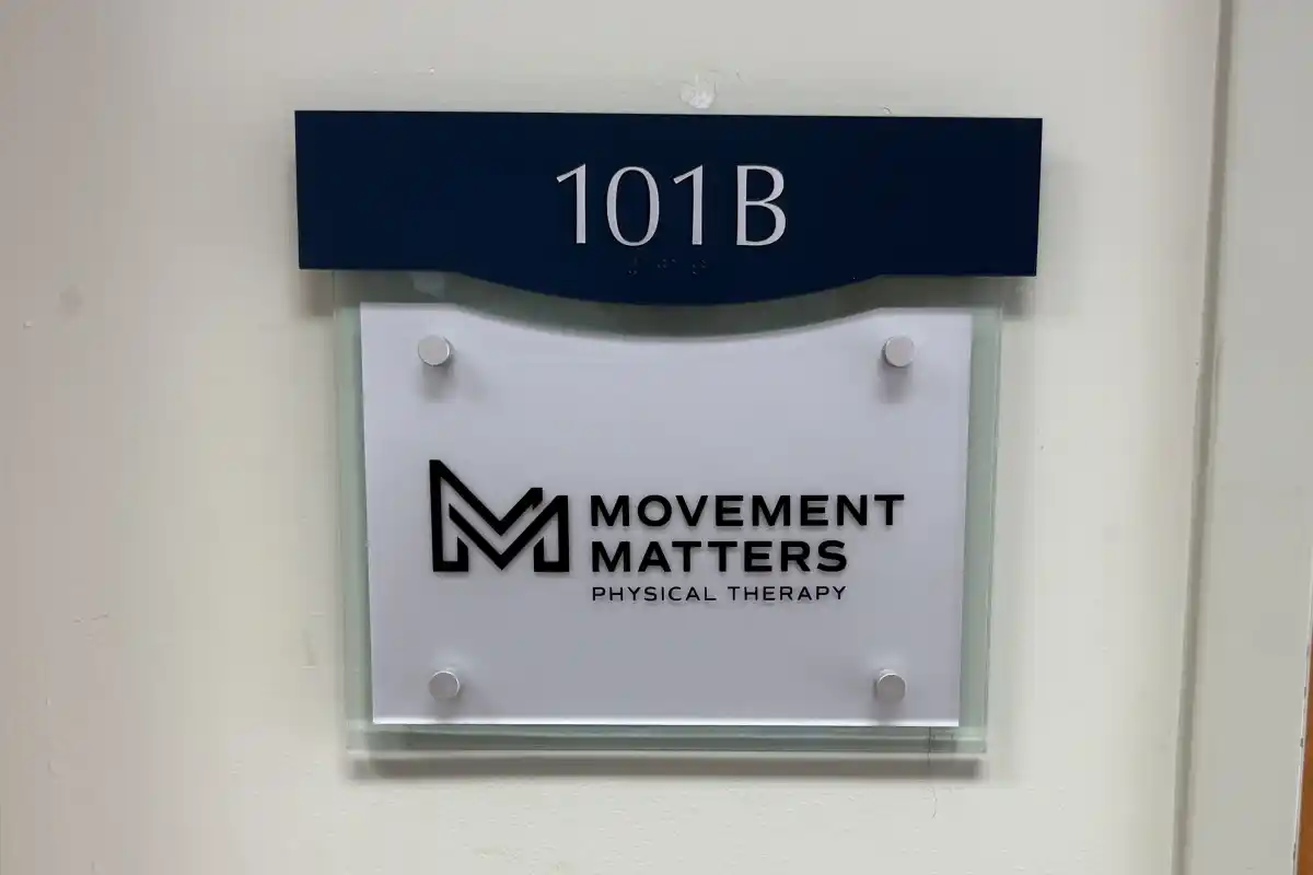 Door sign for office of Movement Matters Physical Therapy