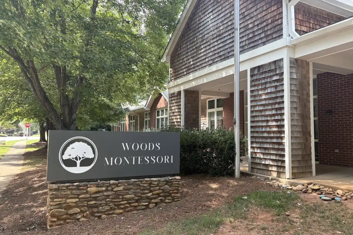Sign and building exterior of Woods Montessori School