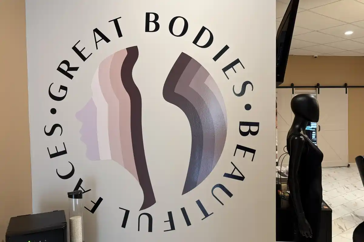 Logo for Great Bodies Beautiful Faces on interior waiting room wall