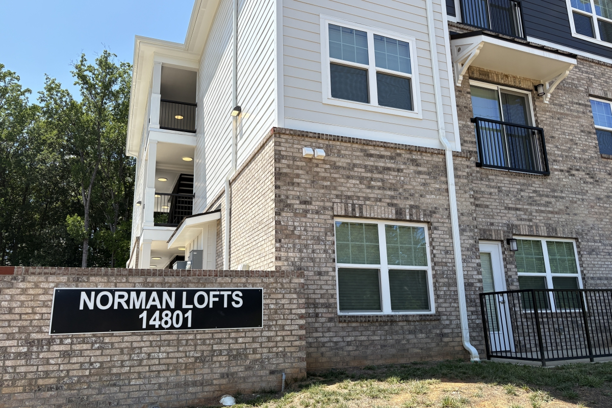 Building exterior and sign for Norman Lofts Apartments