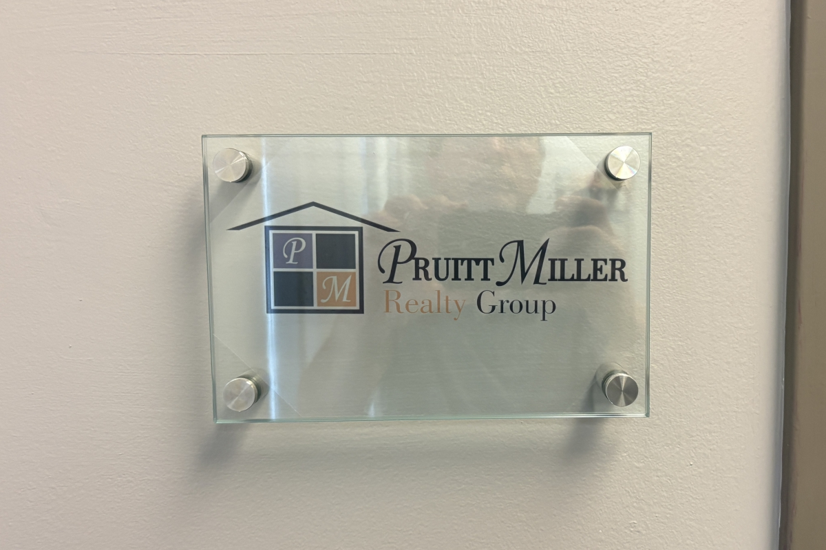Office door placard for Pruitt Miller Realty Group