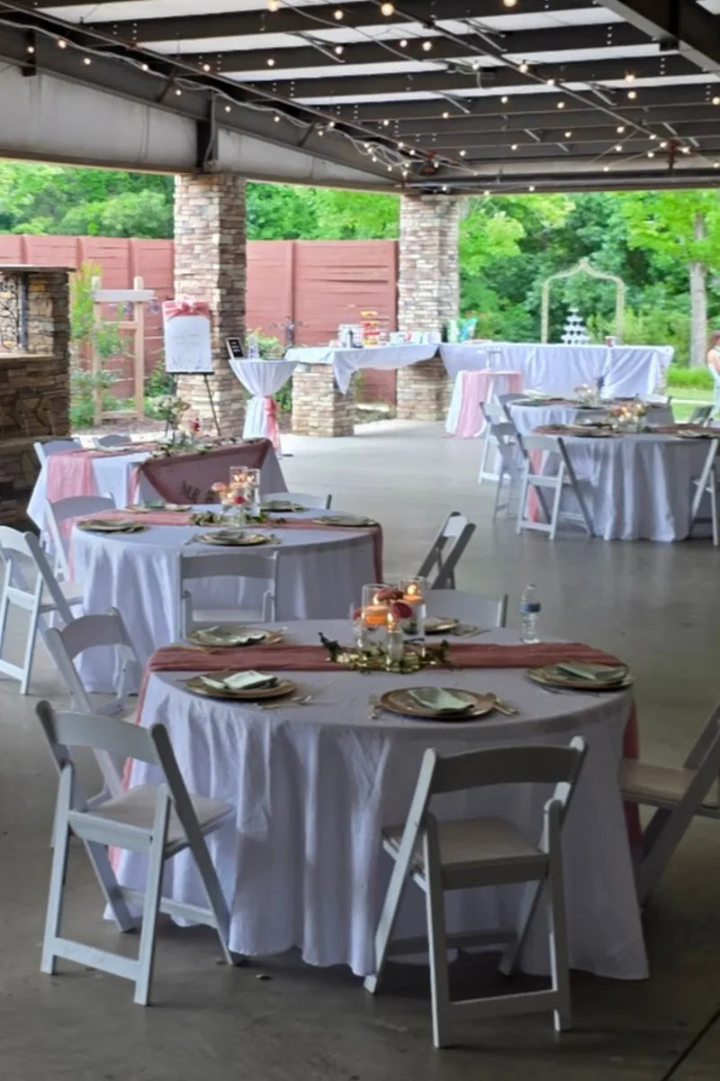 Covered patio set for a wedding reception at Magnolia Woods