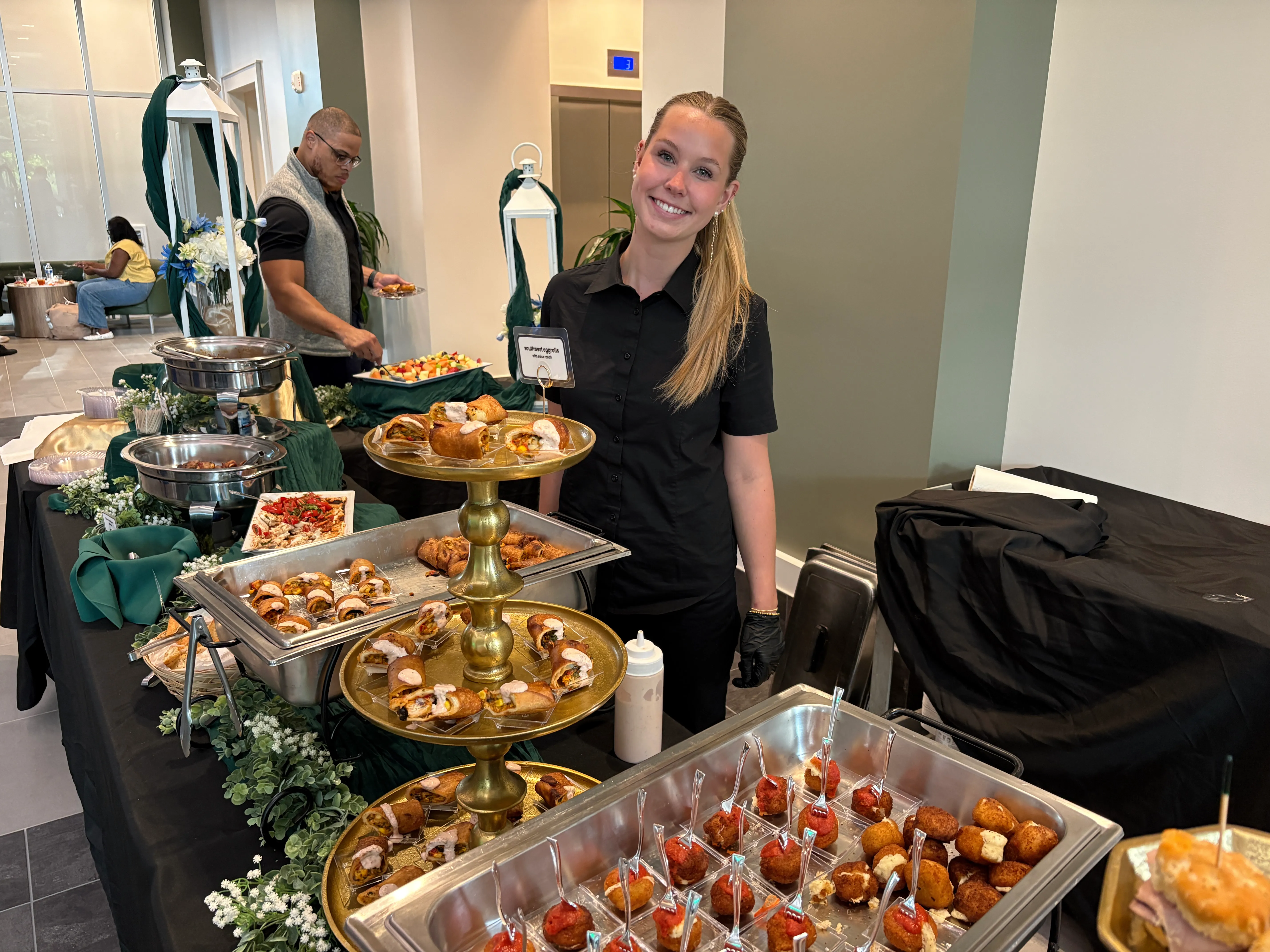 Savory Moments Catering staff members at a buffet table