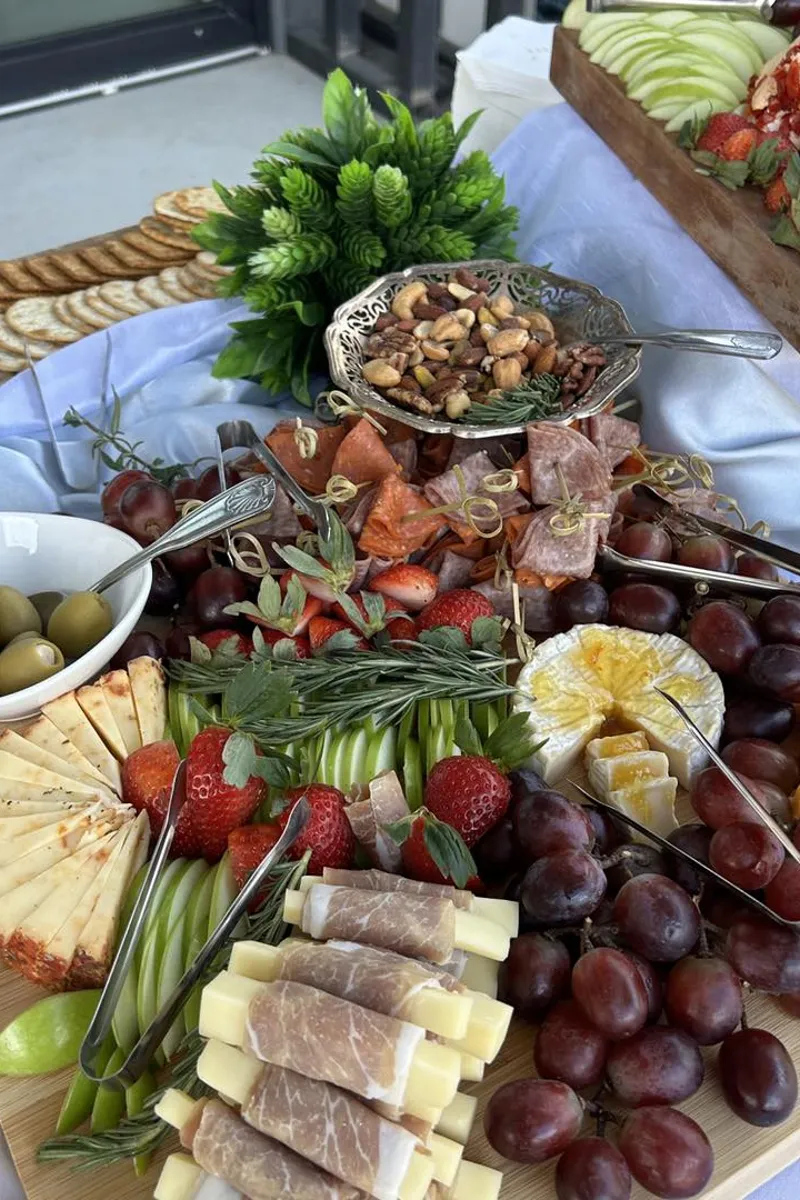 Grazing board with cheese, meats, and fruit from Savory Moments Catering