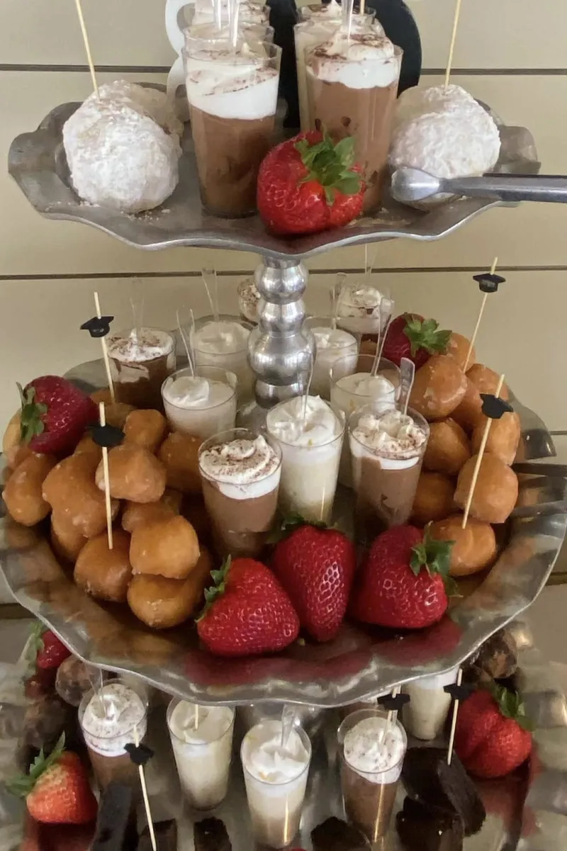 Dessert tower with mousse shots and strawberries from Savory Moments Catering