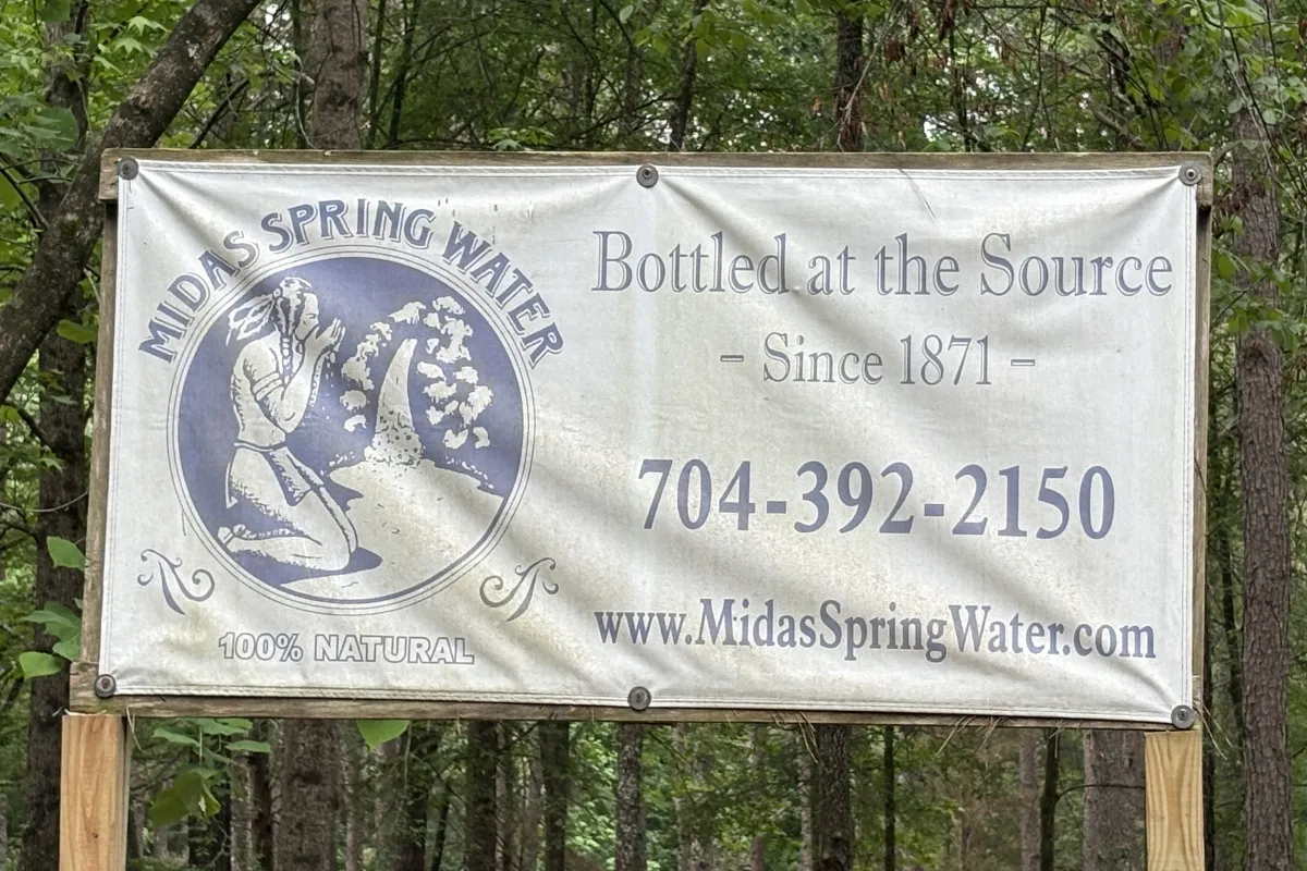 Roadside banner reading "Bottled at the Source, Since 1871"