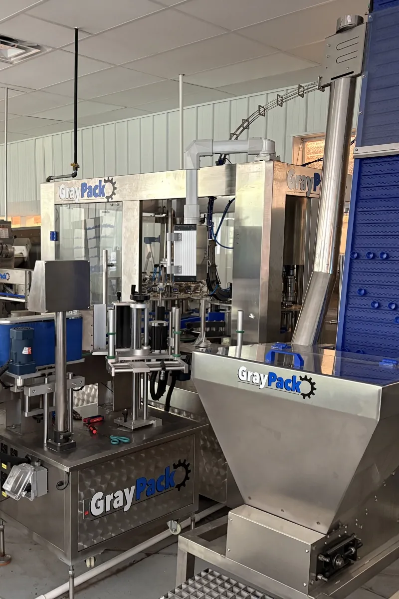 Close-up of labeling machinery on the bottling line