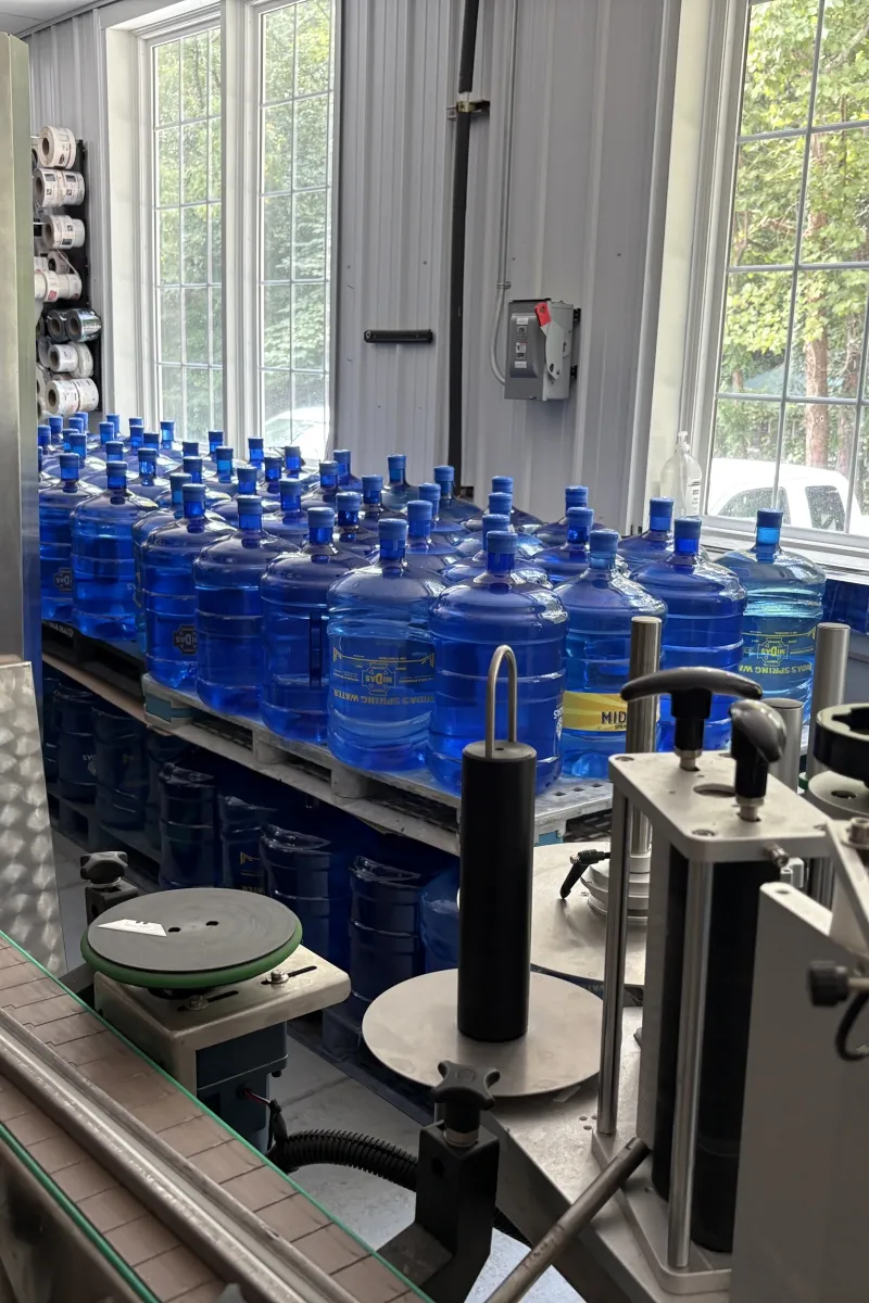 Bottling line equipment filling Midas Spring Water containers