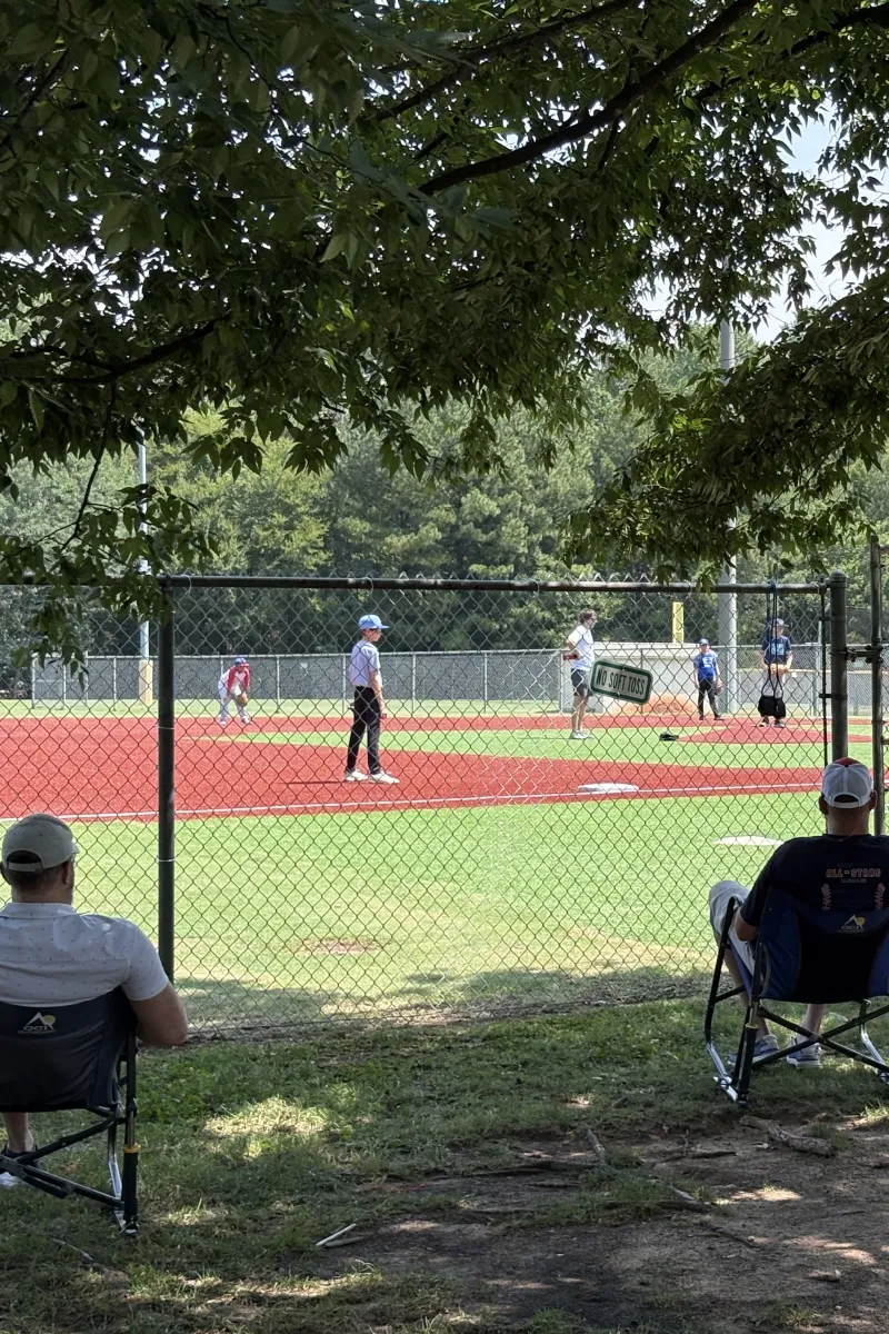 Parents watching baseball from chairs at Huntersville Athletic Park