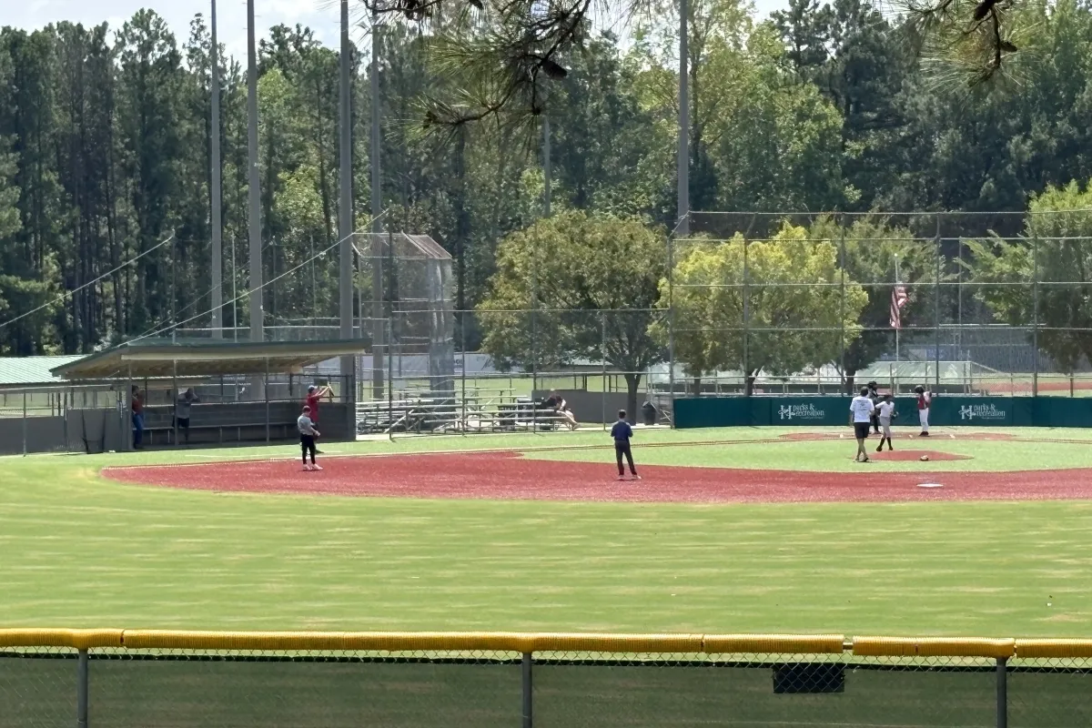 Kids playing baseball on a field at Huntersville Athletic Park