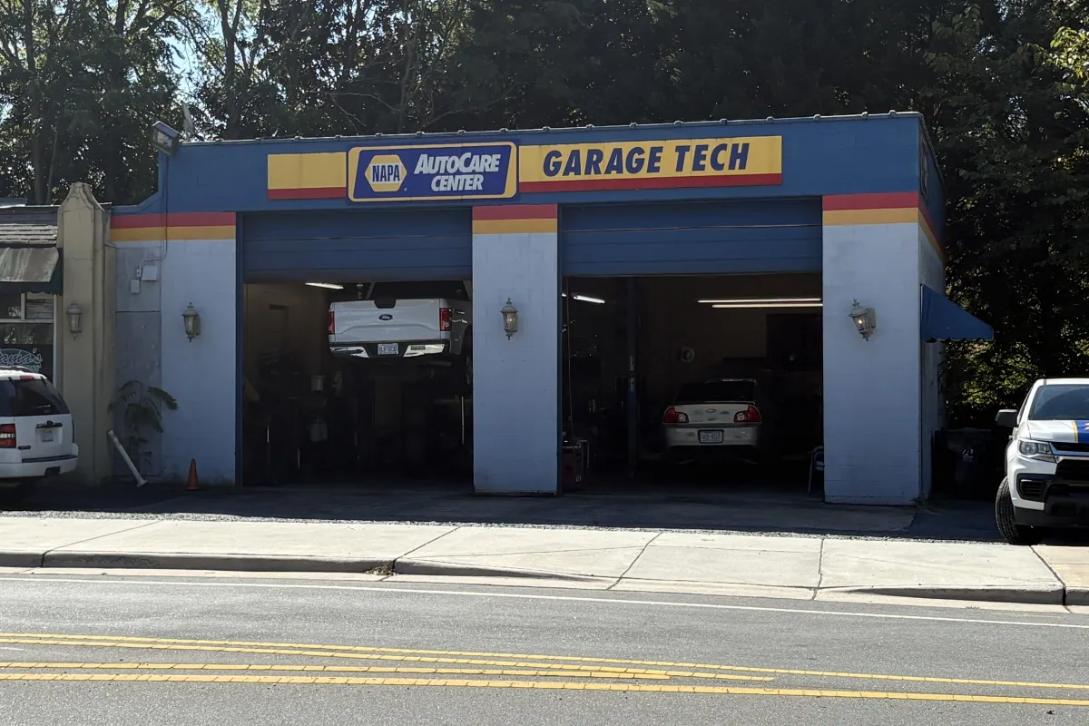Garage Tech open bays with cars being worked on in a garage