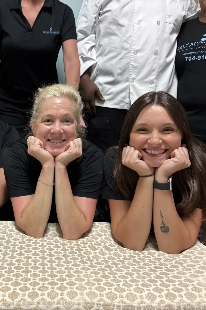 Two smiling staff members at Magnolia Woods