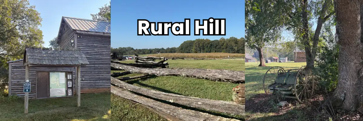 Log outbuilding, split-rail fence along an open field, and an antique farm wagon at Rural Hill