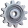 Gray gear or cogwheel icon with detailed teeth.