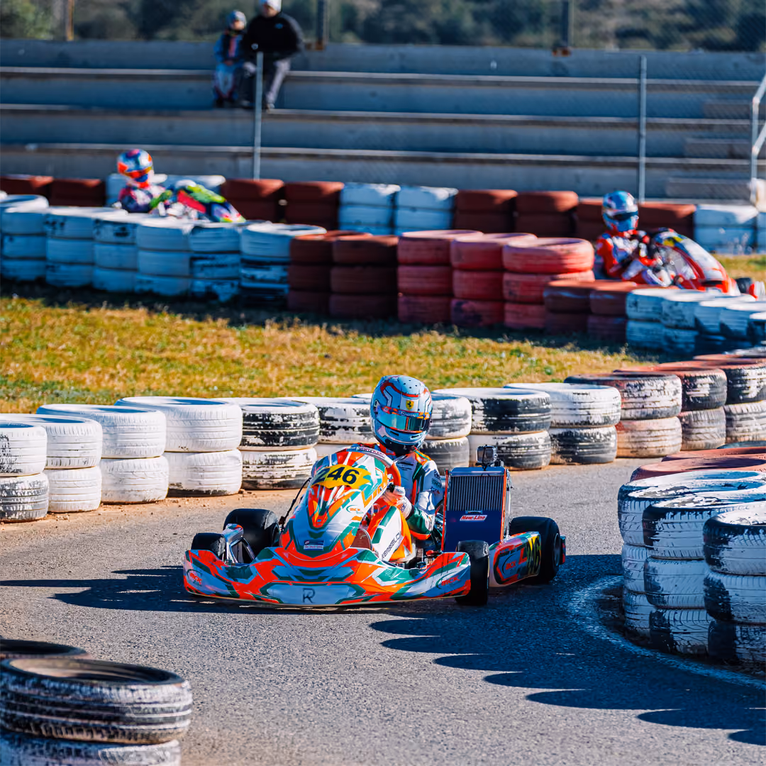 MCK Racing kart in a hairpin lined with tyre barriers in Valencia