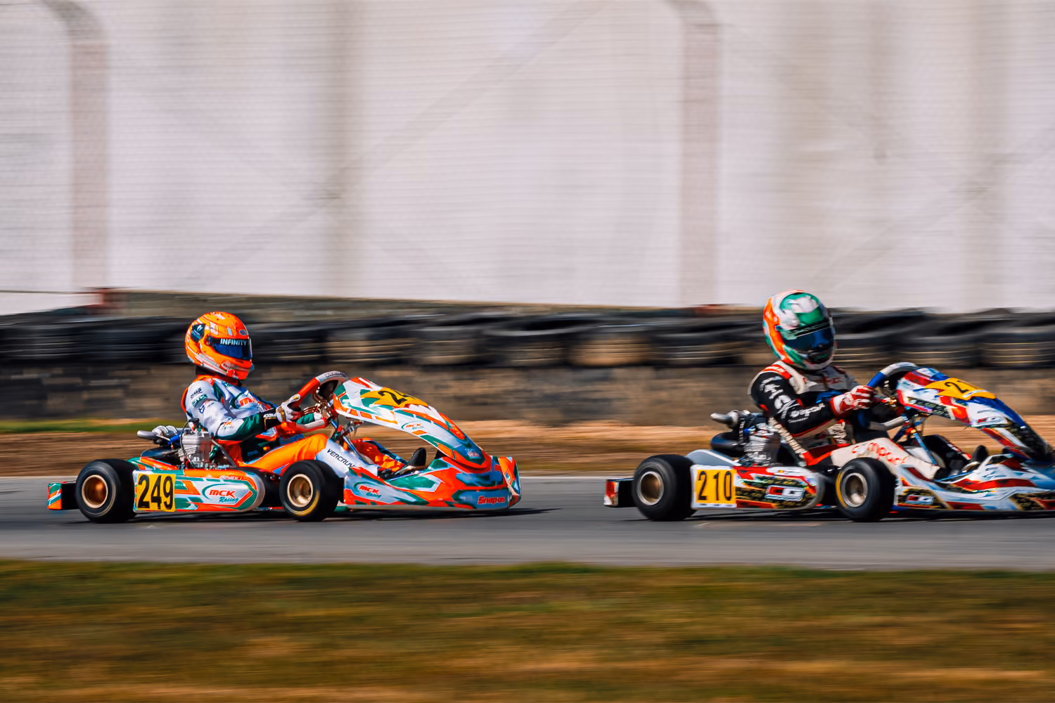 Two MCK Racing karts side by side on the straight in Mariembourg