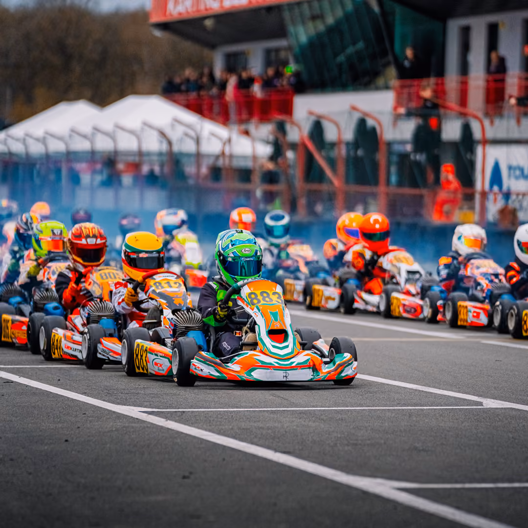 Race start with a full field of karts in Mariembourg