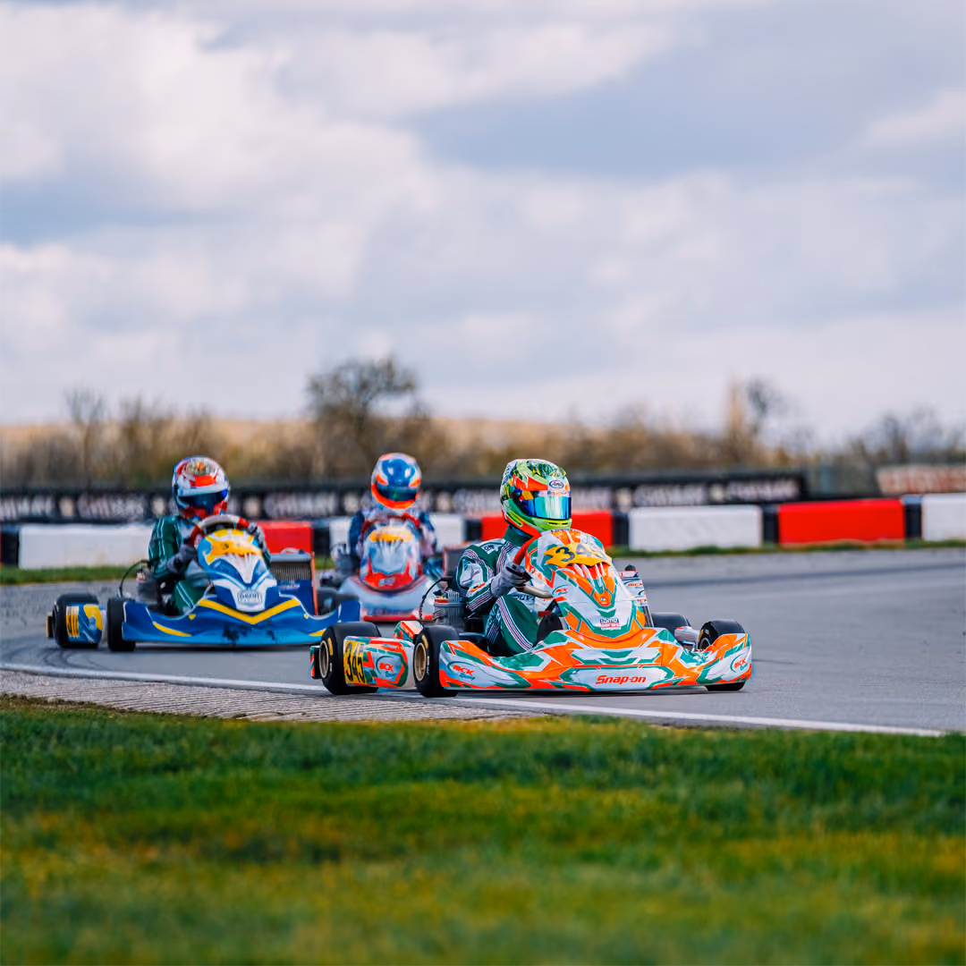 MCK Racing kart leading two rivals in Mariembourg