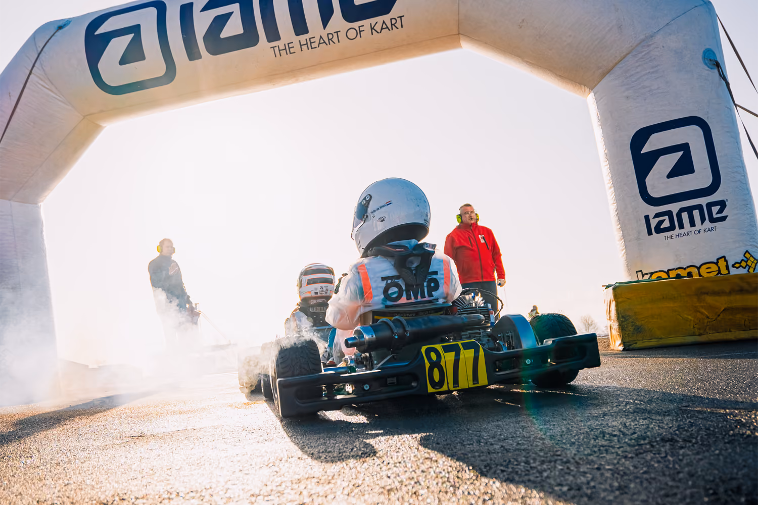 Kart leaving parc fermé under the IAME arch in Mariembourg