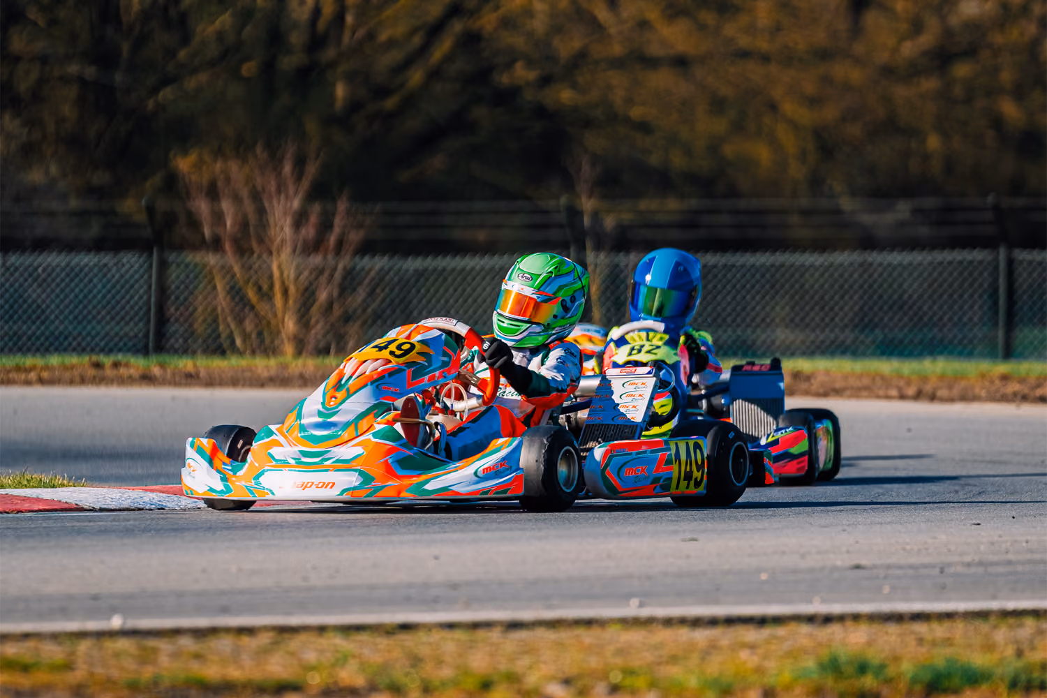 MCK Racing kart ahead of a rival in a corner in Mariembourg