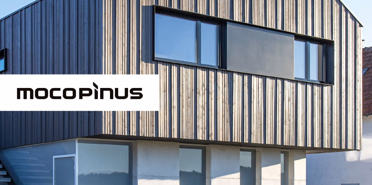 Das Bild zeigt eine Holzfassade eines Hauses der Firma Mocopinus.