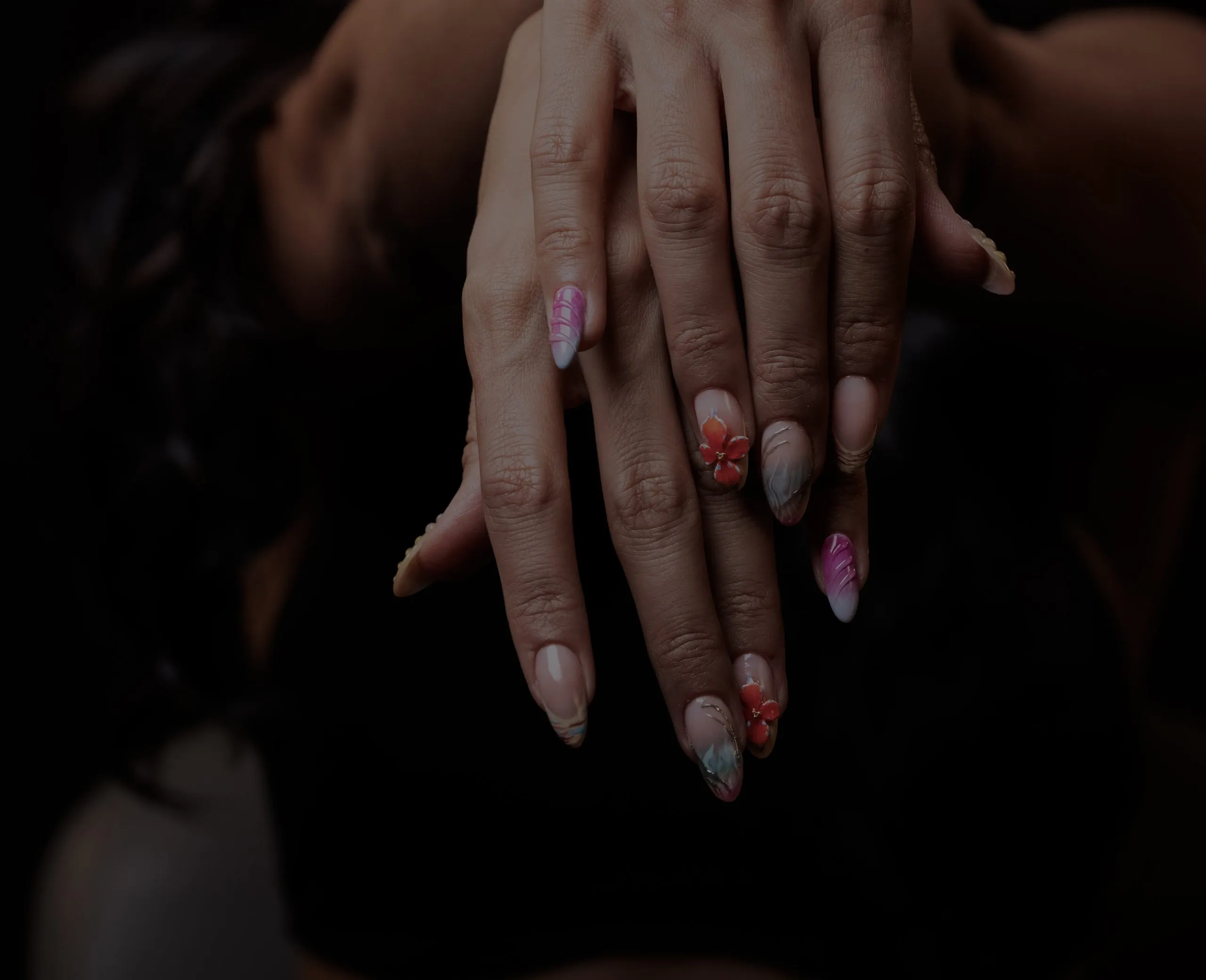 Hand-painted floral nail art created at the March14 Nails Theatre